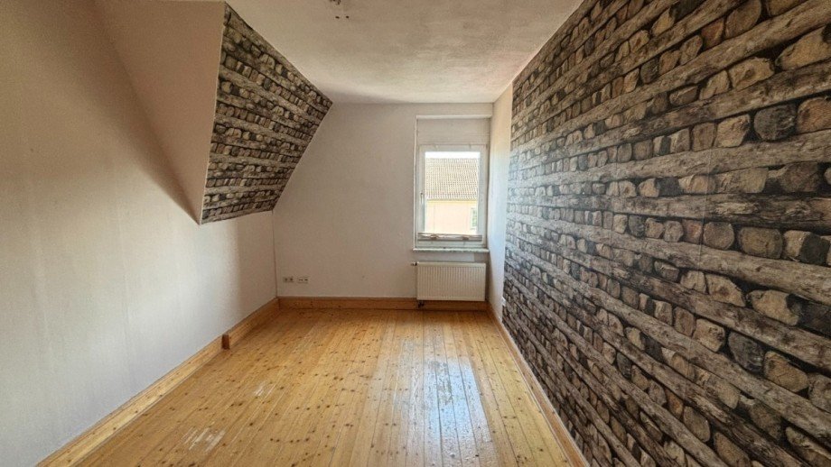 Schlafzimmer - www.immobilien-heise.de Dachgeschosswohnung Holzminden
