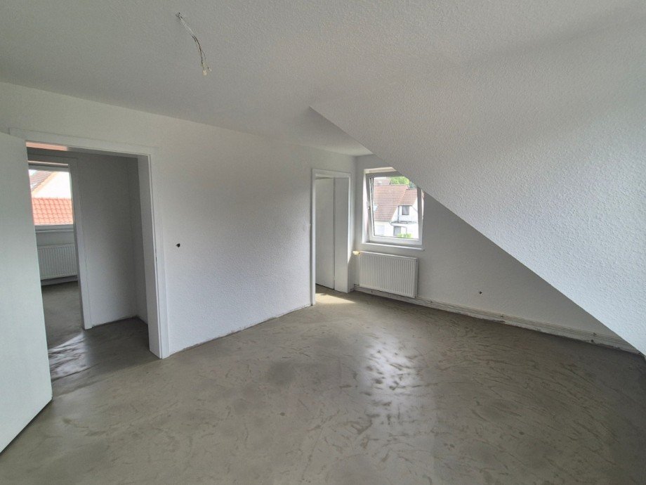 Wohnzimmer - Heise Immobilien Dachgeschosswohnung Holzminden