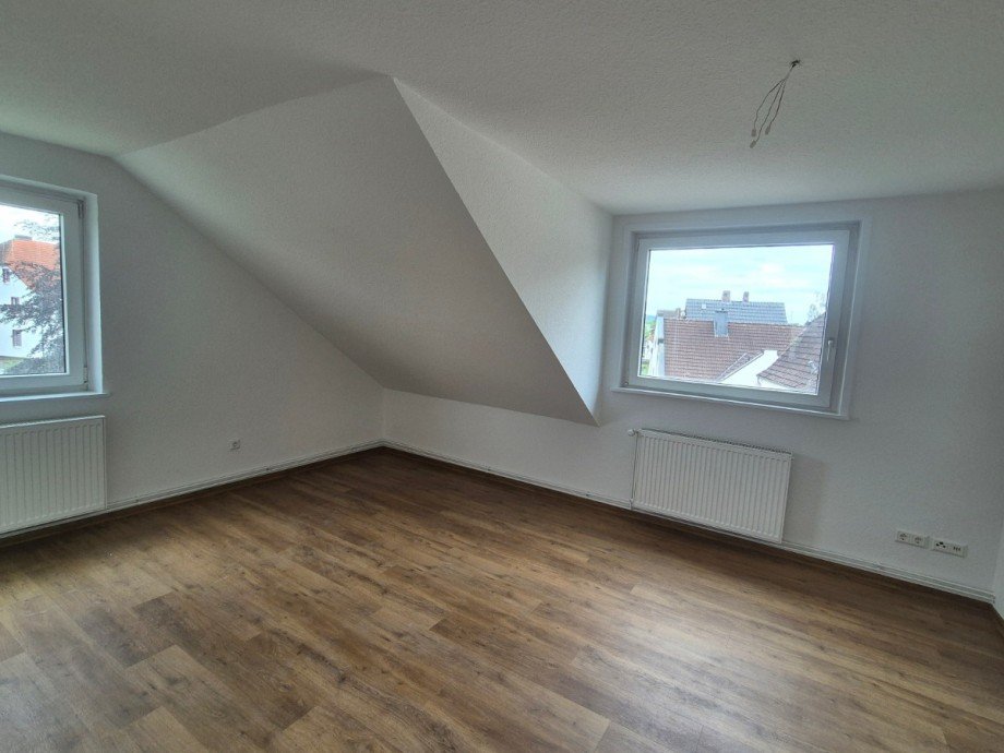 Wohnzimmer - Heise Immobilien Dachgeschosswohnung Holzminden