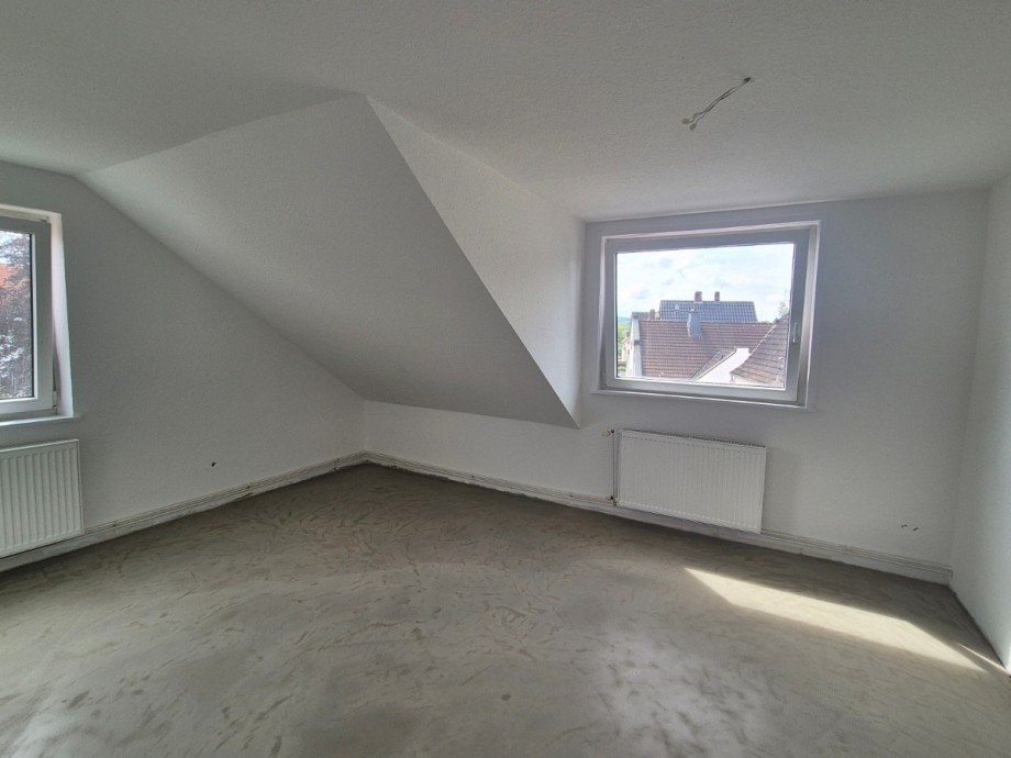 Wohnzimmer - Heise Immobilien Dachgeschosswohnung Holzminden